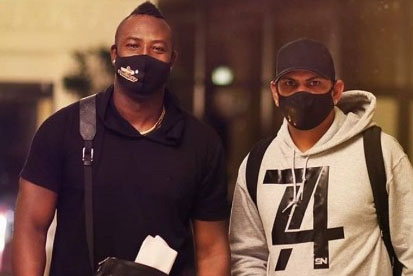 West Indies stars Andre Russell (left) and Sunil Narine arrive in Abu Dhabi.