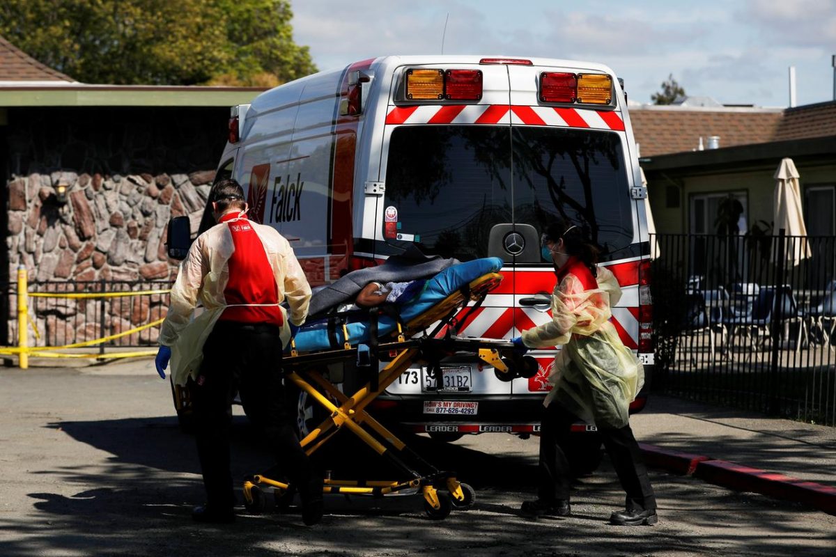 An ambulance crew transports a patient to Gateway Care and Rehabilitation Center, where 7 deaths and 65 confirmed cases of coronavirus disease (COVID-19) among its staff and patients were reported, in Hayward, California, U.S. April 10, 2020. REUTERS/Stephen Lam