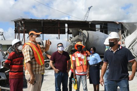 Minister of Public Works Juan Edghill (second from left) during the visit yesterday. (Ministry of Public Works photo)
