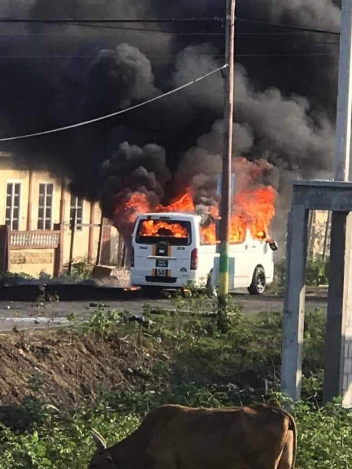 The torched bus of a Bath resident