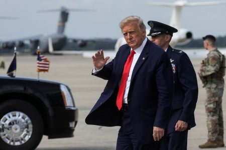 FILE PHOTO: U.S. President Donald Trump waves after returning to Washington from travel to Wilmington, North Carolina at Joint Base Andrews, Maryland, U.S., September 2, 2020. REUTERS/Leah Millis