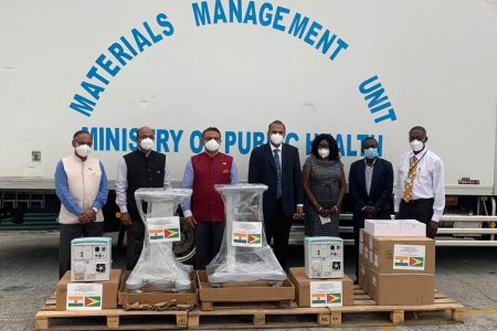 High Commissioner of India, Dr K.J. Srinivasa (third from left) and Minister of Health, Dr Frank Anthony (fourth from left) with some of the equipment handed over.
