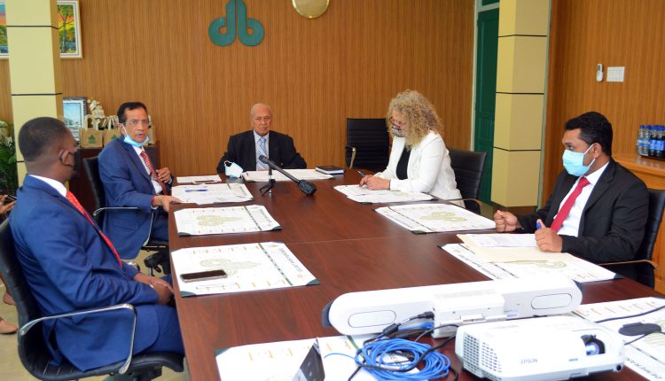 Demerara Bank Limited Chairman and founder Dr. Yesu Persaud (centre) with Chief Executive Officer of DBL, Pravinchandra Dave (second from left), IDB country representative Sophie Makonnen (second from right) and others (Photo by Orlando Charles)
