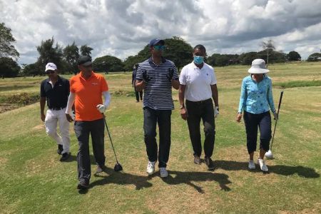 Minister of Culture, Youth and Sport Charles Ramson Jr. (centre) makes a point during his recent visit to the Lusignan Golf Club
