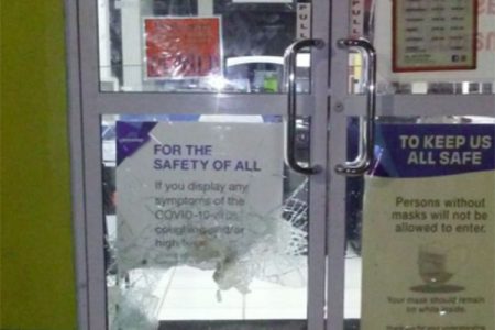 The smashed glass on the lower part of the door