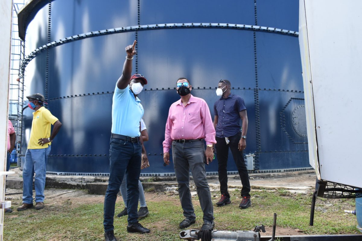 Minister of Housing and Water Collin Croal (second from right) during his visit to Bartica. (GWI photo)