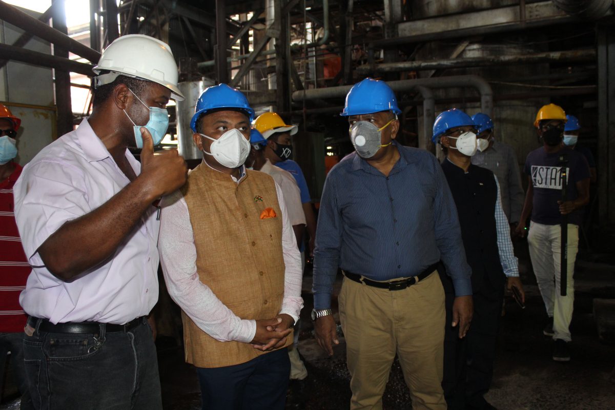 From left are Hutton Griffith, Manager of the Blairmont Estate; Indian High Commissioner, Dr. K. J. Srinivasa and Minister of Agriculture Zulfikar Mustapha touring the Blairmont factory. 