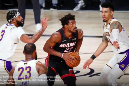 ONE MAN ARMY? Miami Heat’s Jimmy Butler is surrounded by the Los Angeles Lakers’ Anthony Davis, LeBron James and Danny Green during Monday night’s Game Three which the Heat won 115-104 behind Butler’s 40-point triple double. (Reuters photo)
