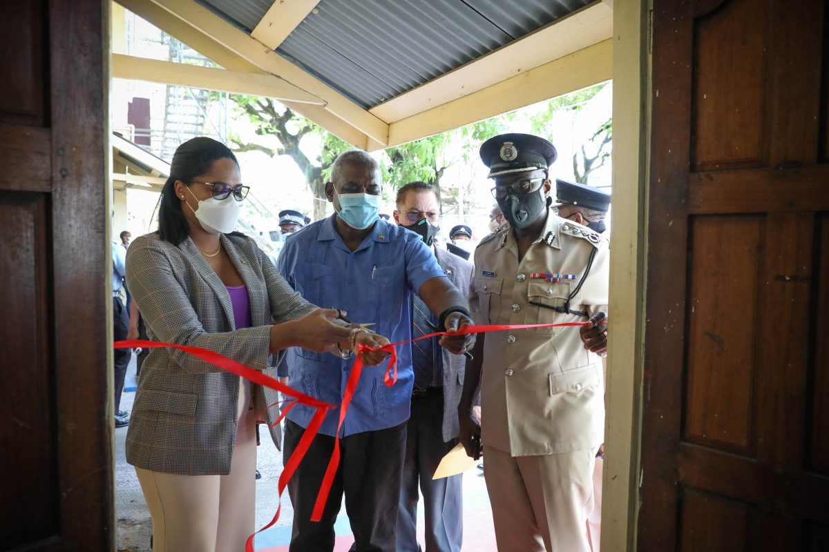 Permanent Secretary of the Ministry of Home Affairs Mae Thomas (left), Minister of Home Affairs Robeson Benn (centre) and Commissioner of Police (ag) Nigel Hoppie participated in the cutting of the ribbon. (DPI photo)
