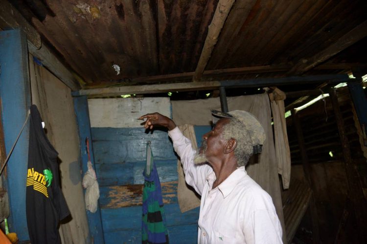 James Smith in his Kent Village, St Catherine house, which is in need of repairs.
