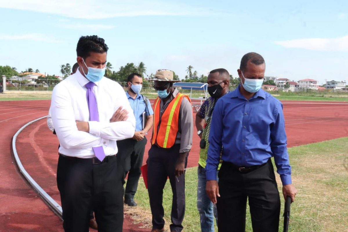 Minister of Sport, Charles Ramson Jr (left) along with members of the Athletic Association of Guyana (AAG) conducted a thorough walk through and inspection of the National Track and Field Centre at Leonora yesterday. The facility has been earmarked to host the 50th edition of the CARIFTA Games in 2022.
