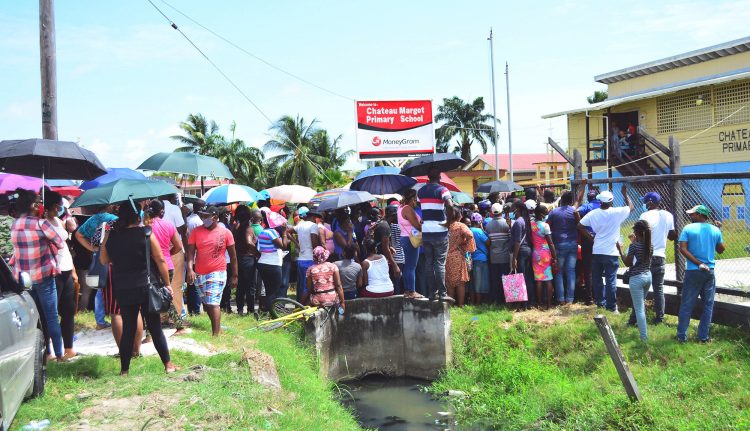 Some residents who were lined up in front the Chateau Margot Primary School