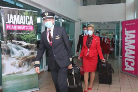 Virgin Atlantic crew exit the aircraft after arrival at the Sangster International Airport.