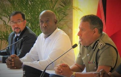 Commissioner of Police Gary Griffith, right, speaks during a recent meeting with Prime Minister Dr Keith Rowley, centre, and National Security Minister, Stuart Young.