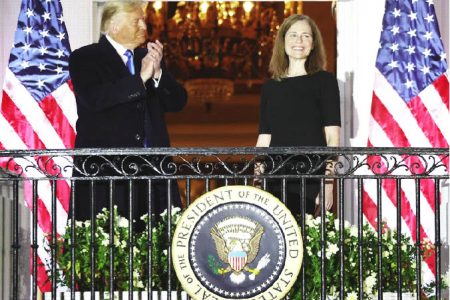 US President Donald Trump applauds U.S. Supreme Court Associate Justice Amy Coney Barrett after she took her oath of office and was sworn in to serve on the court on the South Lawn of the White House in Washington, US, October 26, 2020. REUTERS/Jonathan Ernst