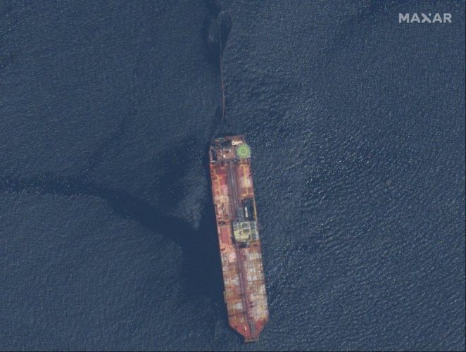 This satellite image released by Maxar Technologies shows the FSO Nabarima oil tanker off the coast of Trinidad and Tobago, Sunday, Aug. 9, 2020. The oil tanker listing off a remote Venezuelan coastline is triggering international calls for action. Critics of President Nicolas Maduro and maritime experts say the FSO Nabarima is taking on water and could sink