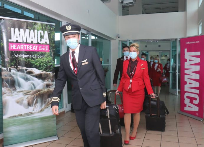 Virgin Atlantic crew exit the aircraft after arrival at the Sangster International Airport.
