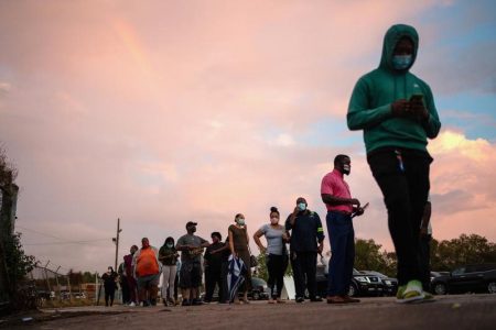 People line up to cast their ballot for the upcoming presidential election as early voting ends as tropical storm Zeta approaches the Gulf Coast in New Orleans, Louisiana, U.S., October 27, 2020. REUTERS/Kathleen Flynn