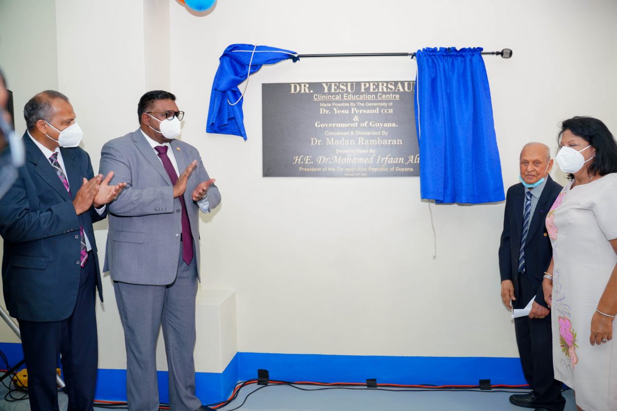 Dr Yesu Persaud (second from right) with from left, Minister of Health Dr Frank Anthony, President Irfaan Ali and Chandra Gajraj. (Office of the President photo)