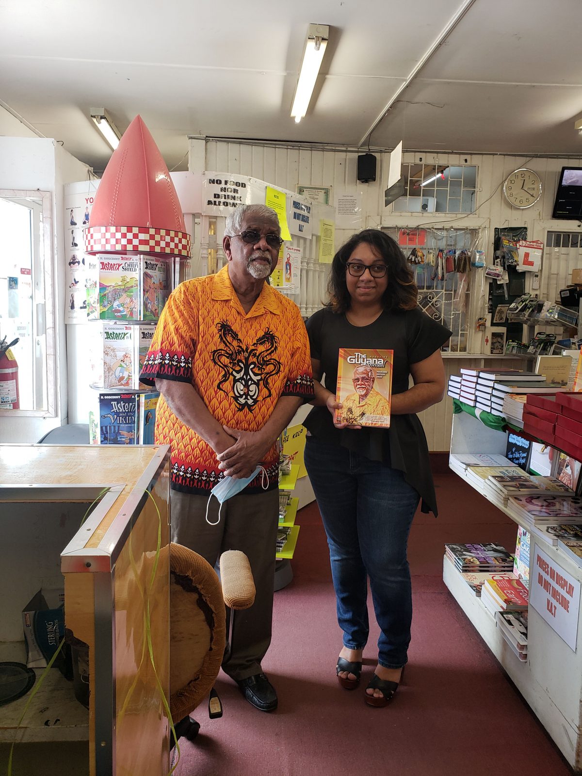 Alan A Fenty along with the winner of the Dr Paloma Mohamed-Martin Prize for Playwriting Drama, Gabrielle Mohamed, during a signing on Friday at Austin’s Book Services 