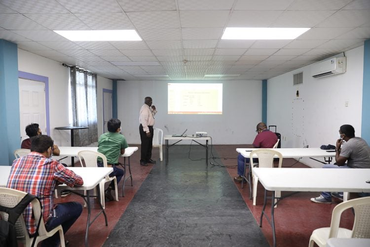  Manager of GPL’s System Control and Engineering Services Deryck Phil training Giftland Mall operators as the preparations move apace to boost power supply. (DPI photo) 