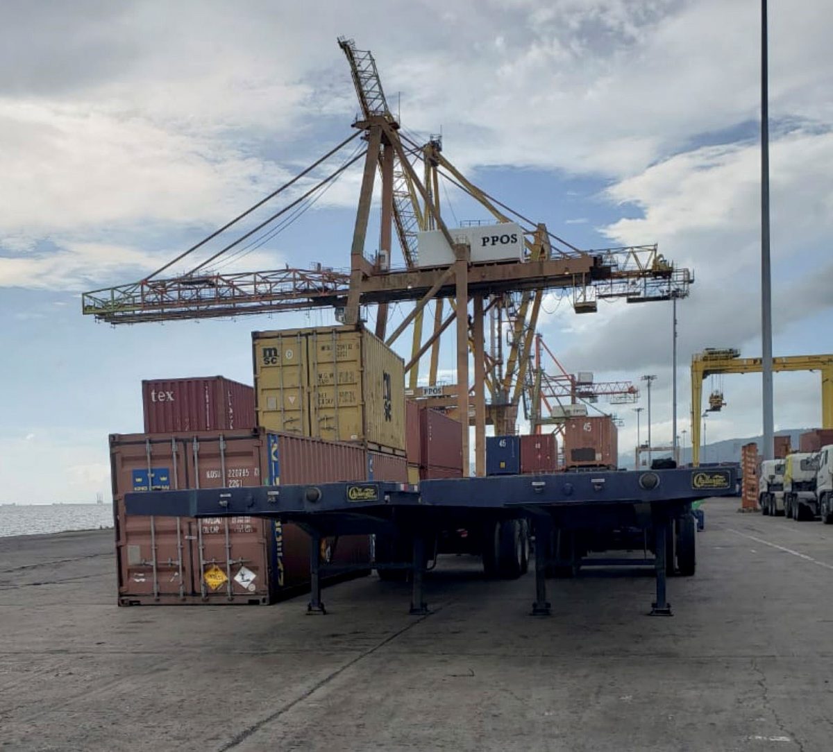 Two of the four unregistered flat-bed trailers belonging to a well-known contractor that customs and port officials stopped from being loaded onto a vessel bound for Guyana at the Port of Spain port yesterday.