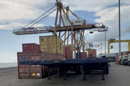 Two of the four unregistered flat-bed trailers belonging to a well-known contractor that customs and port officials stopped from being loaded onto a vessel bound for Guyana at the Port of Spain port yesterday.