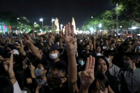 People shows three fingers salute during a rally to call for the ouster of Prime Minister Prayuth Chan-ocha's government and reforms in the monarchy in Bangkok, Thailand, November 14, 2020. REUTERS/Soe Zeya Tun