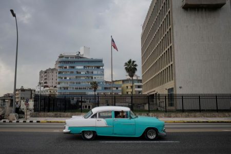 A vintage car passes by the U.S. Embassy in Havana, Cuba, October 30, 2020. Picture taken October 30, 2020. REUTERS/Alexandre Meneghini