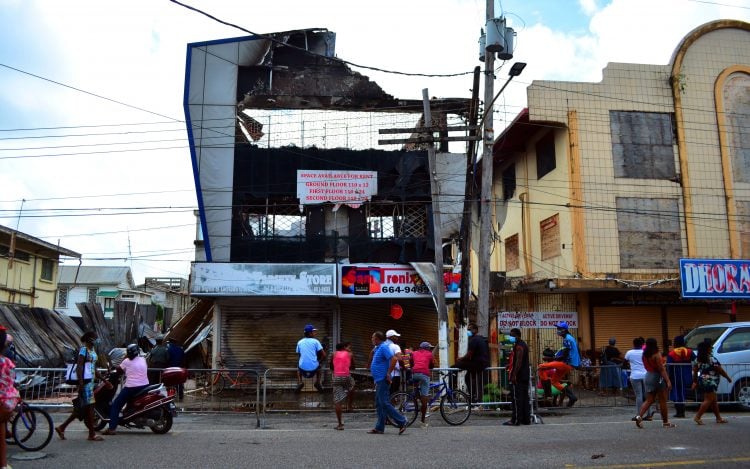 The burnt Singh’s Electronic World building (Photo by Orlando Charles)