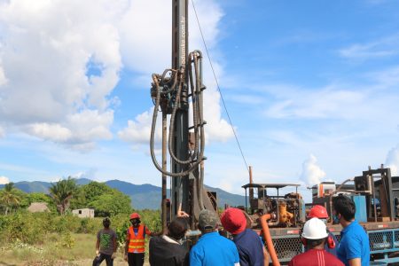 Minister of Housing and Water, Collin Croal and a team of GWI and Regional Officials at the well drilling site in Shulinab.  (GWI photo)