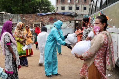 FILE PHOTO: Volunteers from an organisation distribute relief supplies among transgenders, amid the coronavirus disease (COVID-19), in Dhaka, Bangladesh, April 23, 2020. REUTERS/Mohammad Ponir Hossain/File Photo