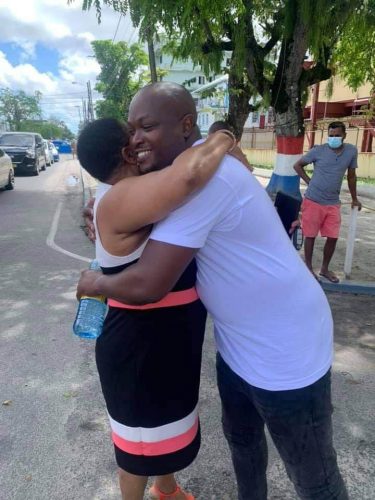 Chairman of the PNCR Volda Lawrence embraces James Bond after his release from the Brickdam lock-up on Friday