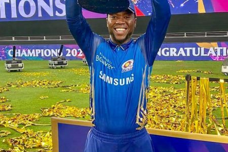 Sherfane Rutherford with the winning IPL trophy.
