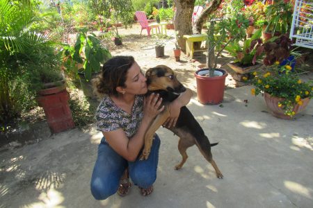 Shari saying goodbye, she is happy this rescued dog found her forever home