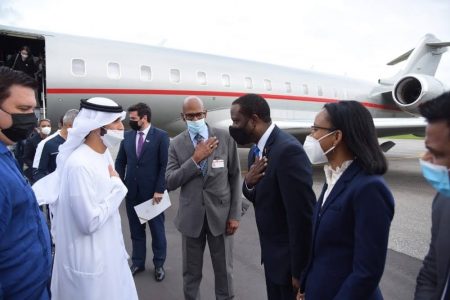 Sheikh Ahmed Dalmook Juma Al Maktoum of the UAE  (second from left) being welcomed to Guyana by Minister of Foreign Affairs Hugh Todd. (CJIA photo)