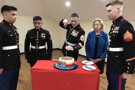 The cutting of the cake. US Ambassador Sarah-Ann Lynch is second from right.
