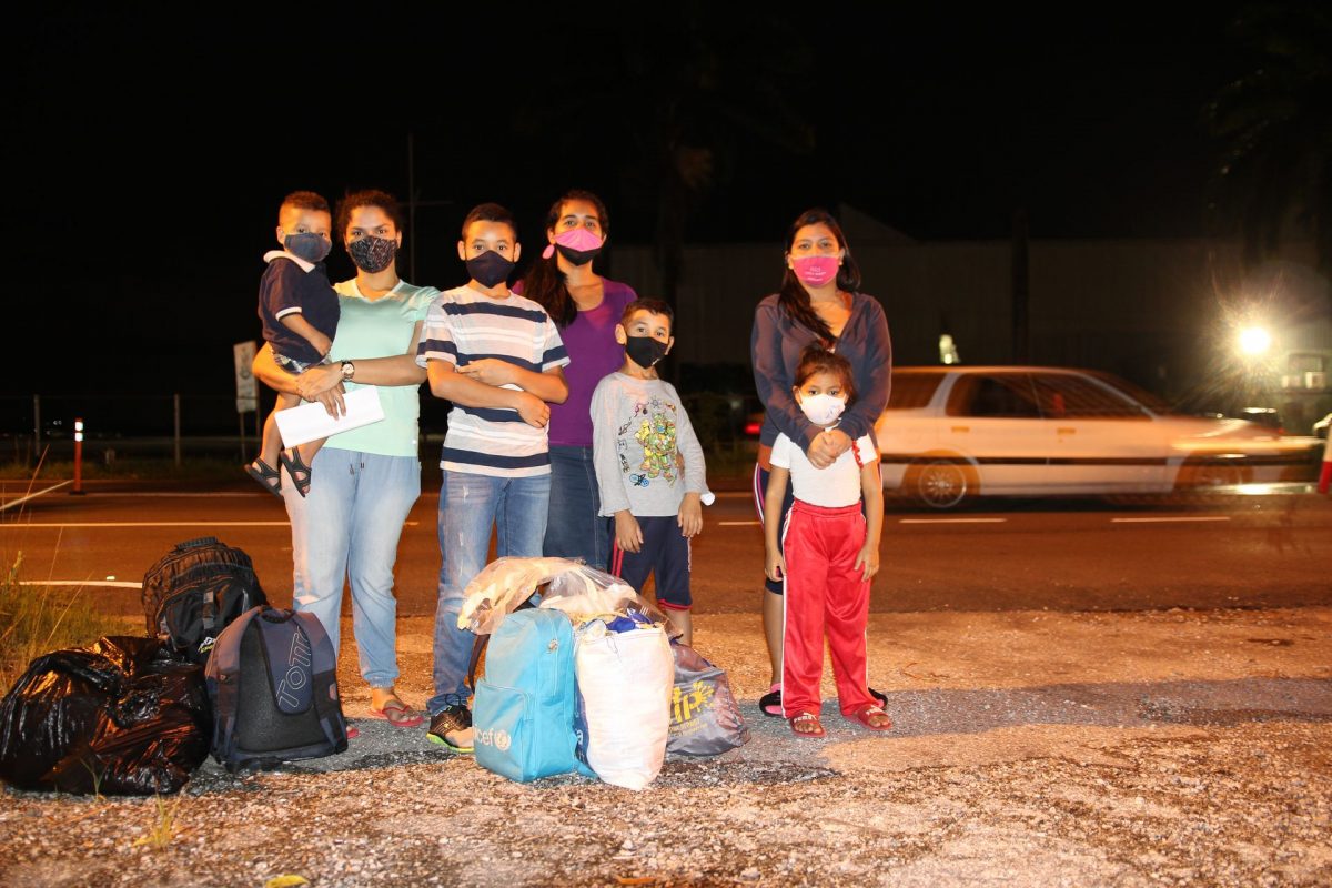 Venezuelan mothers Angel Jimenez, left, Nahomy Aray, centre and Yemilys Del Carmen Cedeno Navarro with their children after they were released from the migrant detention centre at the T&T Coast Guard’s Heliport in Chaguaramas last night.