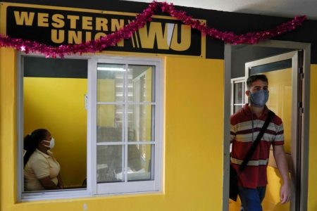 A client leaves a Western Union office in Havana, Cuba, November 23, 2020.  REUTERS/Alexandre Meneghini