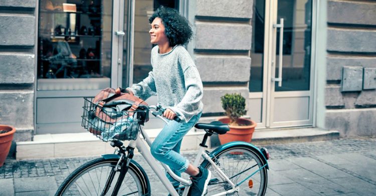 A woman on her bicycle. (https://www.healthline.com photo)