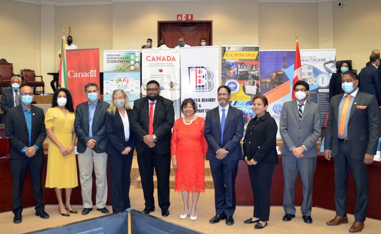 President Irfaan Ali and Canadian High Commissioner Lilian Chatterjee flanked by members of the Canada Guyana Chamber of Commerce at yesterday’s launch. 