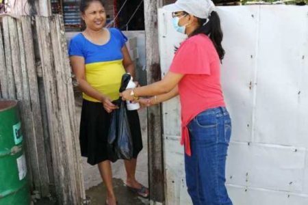 One of the affected households receiving a hamper from the CDC (DPI photo)

