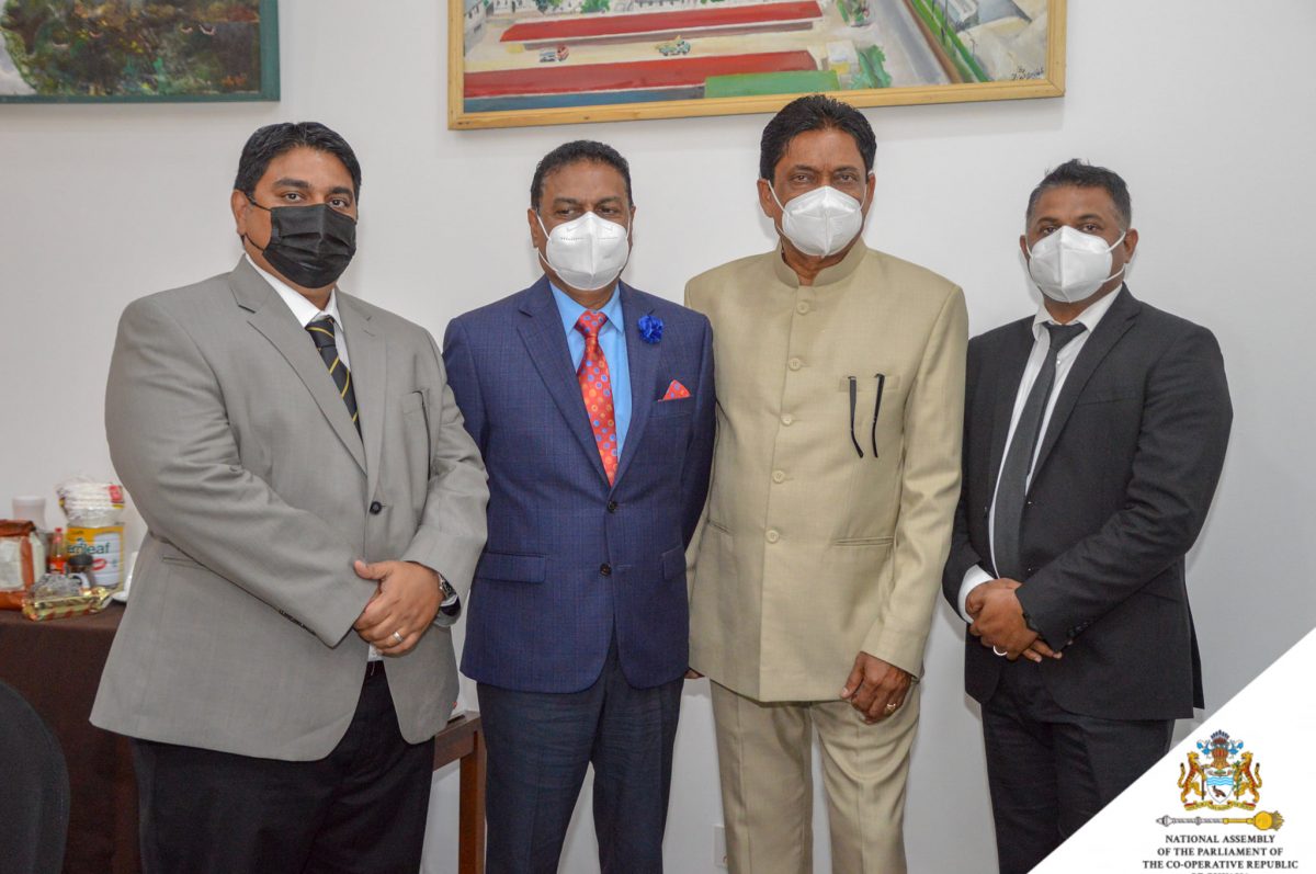 Charrandass Persaud (third from left) with Speaker Manzoor Nadir (second from left) and government parliamentarians yesterday. 

