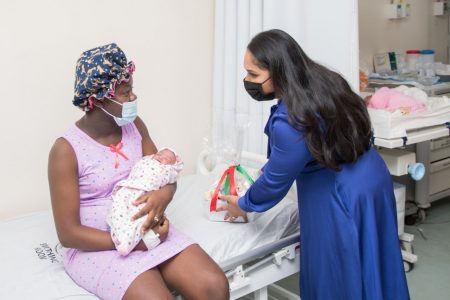11 Christmas babies delivered at GPH: First Lady Arya Ali chats with first time mom Tiffany Ann Smith-John, who delivered a girl on Christmas morning at the Georgetown Public Hospital. The Department of Public Information (DPI) said 11 babies were born on Christmas Day at the hospital, including a boy and girl who were born exactly one minute past midnight on Christmas Day to separate parents. Meanwhile, the DPI said the mothers were given care packages by the First Lady.  “As a young mother, I feel everyone needs a little bit of support and as it’s Christmas morning, too, I felt it was my duty as First Lady to visit. I know some moms have a challenging time, but they make it through and I am glad to give my support to our women with the little care packages for our newborns,” Ali said before thanking the nurses and doctors in the maternity unit and the hospital for their work. (DPI photo)