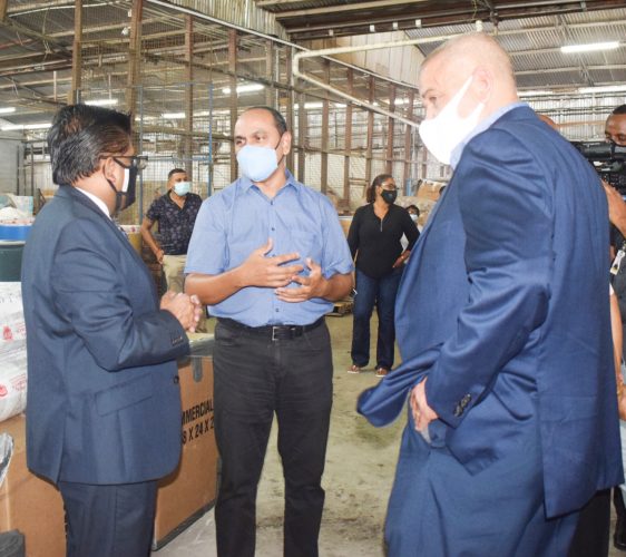 Senior Minister in the Office of the President with responsibility for Finance, Dr. Ashni Singh (left) at one of the GRA facilities. (GRA photo)