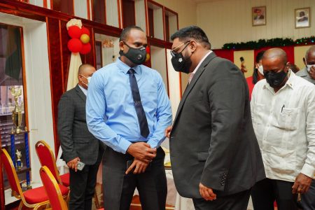 President Irfaan Ali (second from right) in discussion yesterday with Crime Chief Wendell Blanhum. (Office of the President photo)
