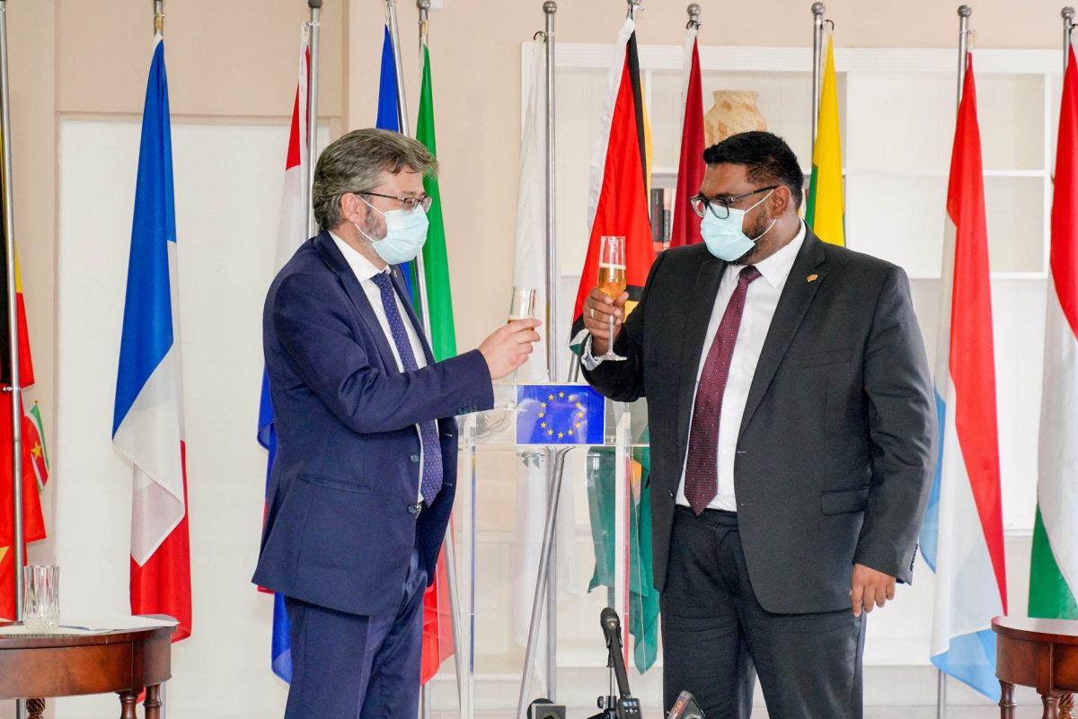President Irfaan Ali (right) and EU Ambassador Fernando Ponz Cantó sharing a toast yesterday.  (Office of the President photo)
