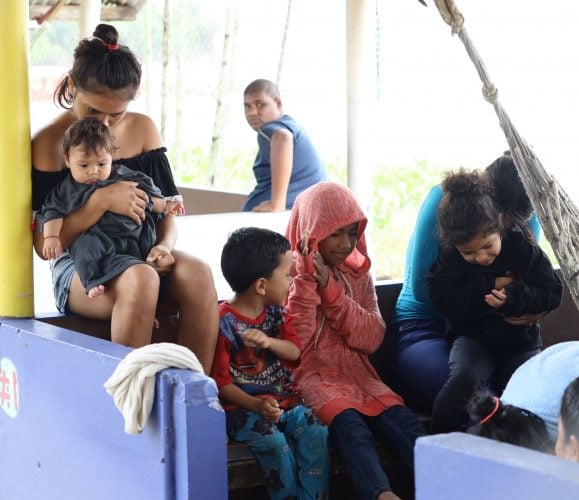 A group of Venezuelans who recently arrived at Los Iros beach, Erin.