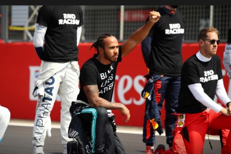 FLASHBACK! August 9, 2020 Mercedes’ Lewis Hamilton kneels in support of the Black Lives Matter campaign on the grid before the race Pool via REUTERS/Bryn Lennon/File Photo
