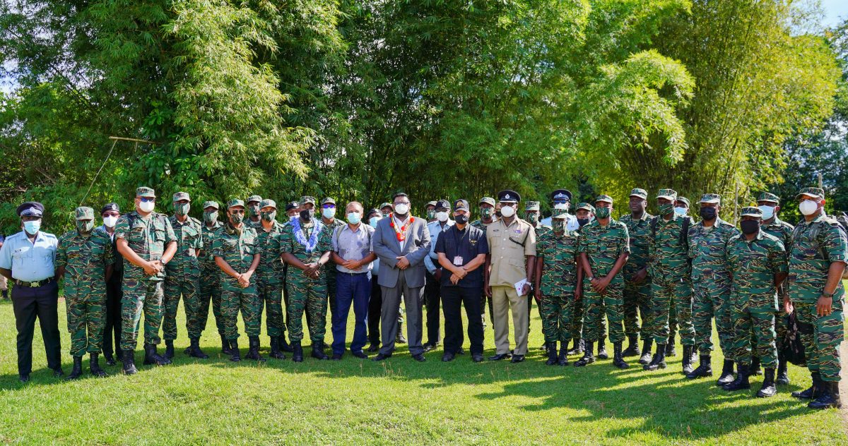 President Irfaan Ali (centre with garland) with army top brass, soldiers and government officials at Kaikan yesterday.  (Office of the President photo)